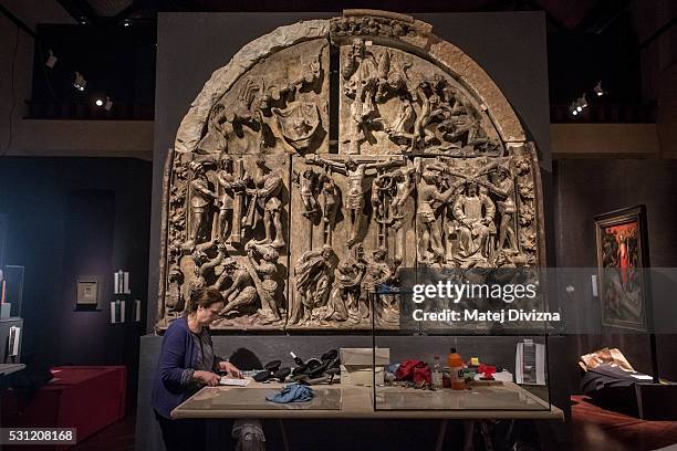 Worker makes final preparations for the 'Emperor Charles IV 1316-2016' exhibiton under the Tympanum with the Passion scenes from the north portal of...