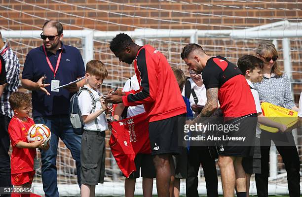 Kolo Toure and Danny Ings of Liverpool sign autographs for school children during a training session at the Liverpool UEFA Europa League Cup Final...
