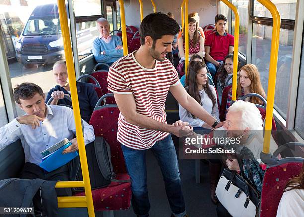 young man helping senior woman - old woman young man stock pictures, royalty-free photos & images