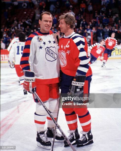 Wayne Gretzky of the Campbell Conference and the Los Angeles Kings poses for a portrait with Mark Messier of the Wales Conference and the New York...