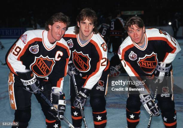 Wayne Gretzky, Luc Robitaille and Jari Kurri of the Campbell Conference and the Los Angeles Kings pose for a portrait before the 1993 44th NHL...