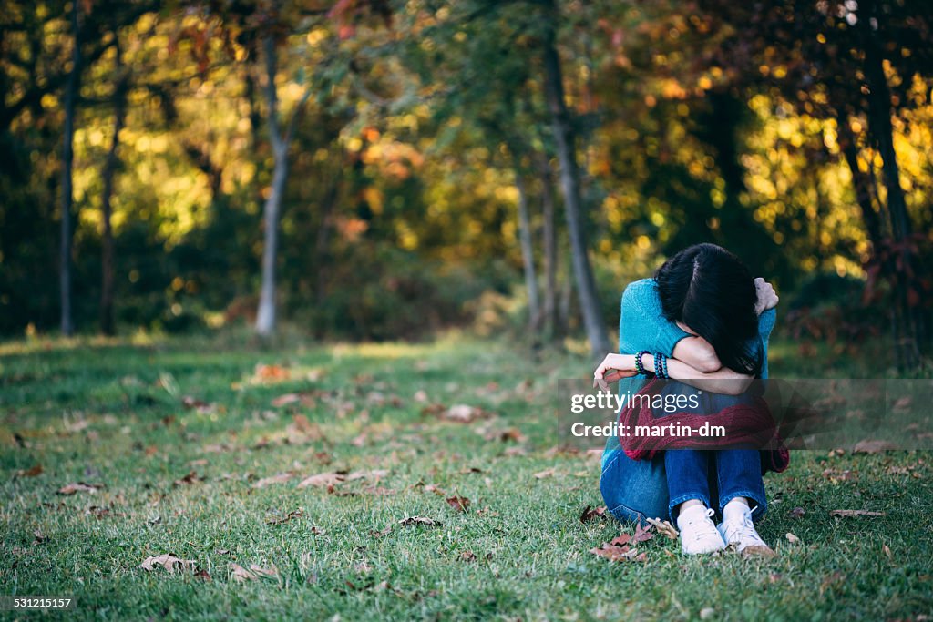 Depressed woman in the park