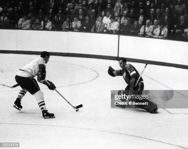 Jean Beliveau of the Montreal Canadiens looks to score on goalie Roger Crozier of the Detroit Red Wings during Game 3 of the 1966 Stanley Cup Finals...