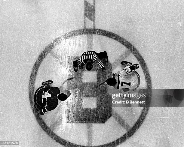 Jean Beliveau of the Montreal Canadiens faces off against Phil Esposito of the Boston Bruins during their game circa 1968 at the Boston Garden in...