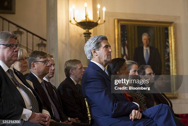 John Kerry, U.S. Secretary of State, center, listens as U.S. President Barack Obama, not pictured, speaks during a welcoming ceremony for a...