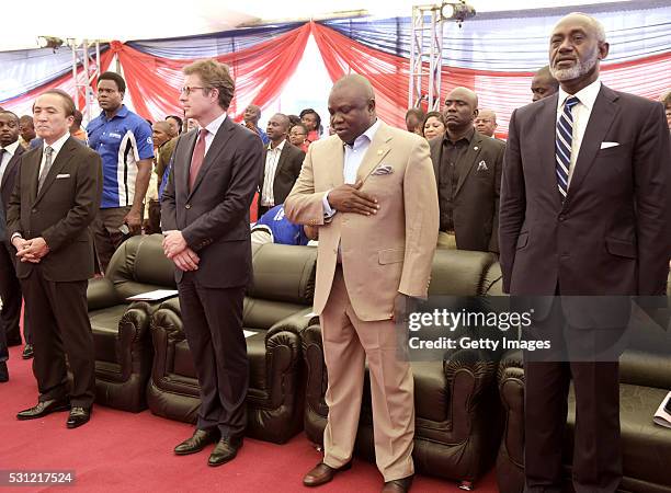 Lagos State Governor Akinwunmi Ambode stands for national anthem accompanied by President, CEO Yamaha Motor Hiroyuki Yanagi , Chairman CFAO S.A....