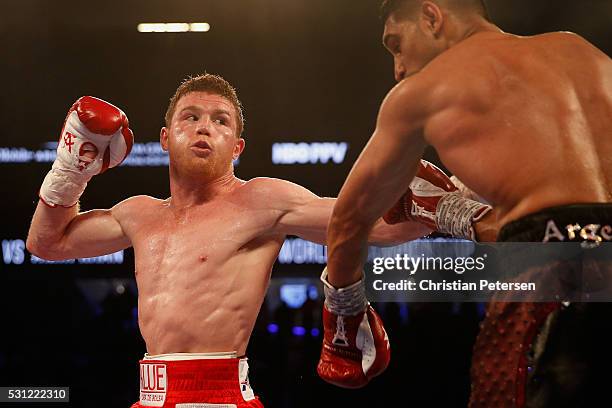 Canelo Alvarez fights with Amir Khan during the WBC middleweight title fight at T-Mobile Arena on May 7, 2016 in Las Vegas, Nevada.