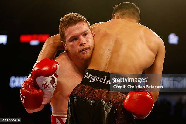 Canelo Alvarez fights with Amir Khan during the WBC middleweight title fight at T-Mobile Arena on May 7, 2016 in Las Vegas, Nevada.