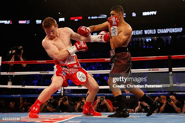 Amir Khan fights with Canelo Alvarez during the WBC middleweight title fight at T-Mobile Arena on May 7, 2016 in Las Vegas, Nevada.