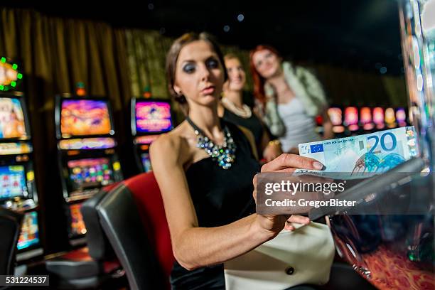 woman in casino - teen pokies stock pictures, royalty-free photos & images