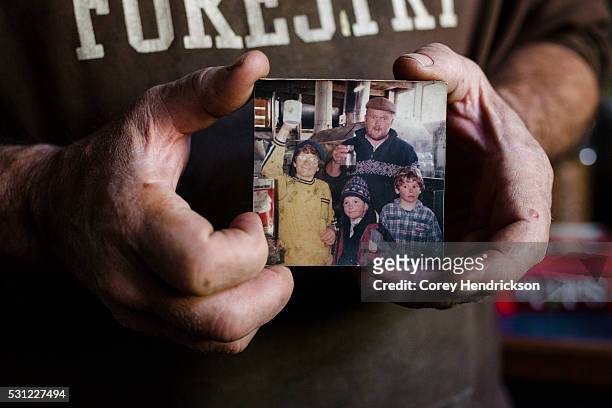 Owen Labrie supporter Marc McKee holding an old photograph taken with Owen while maple sugaring, November 9, 2015 in Vershire, Vermont.