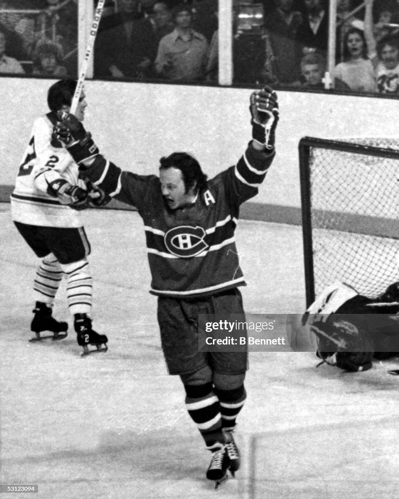 Yvan Cournoyer raises his stick after scoring on the Sabres