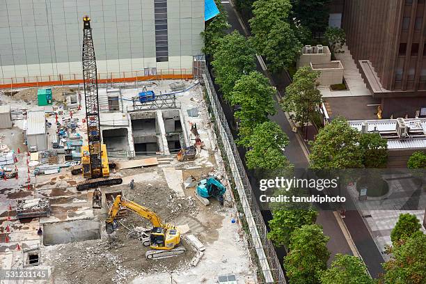building demolishing in japan - grävmaskin bildbanksfoton och bilder