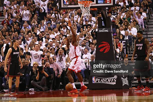 Bismack Biyombo of the Toronto Raptors celebrates a dunk during game five of the NBA Eastern Conference Semi Finals against the Miami Heat at Air...