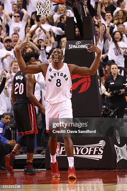 Bismack Biyombo of the Toronto Raptors celebrates a dunk during game five of the NBA Eastern Conference Semi Finals against the Miami Heat at Air...