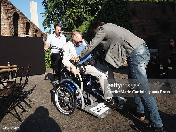 Matteo Lepore assessor for the promotion of the Bologna's municipality unveils the "Aspasso" bike for people with disabilities at Velostazione Dynamo...