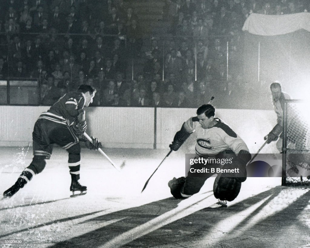 Don Raleigh of the Rangers beats Bill Durnan of the Canadiens