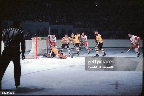 Gordie Howe of the Detroit Red Wings takes the shot during an NHL game against the Boston Bruins circa 1965 at the Boston Garden in Boston,...