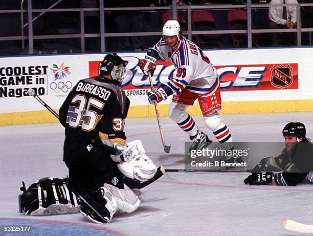 Wayne Gretzky gets a shot off on Pittsburgh goalie Tom Barrasso.