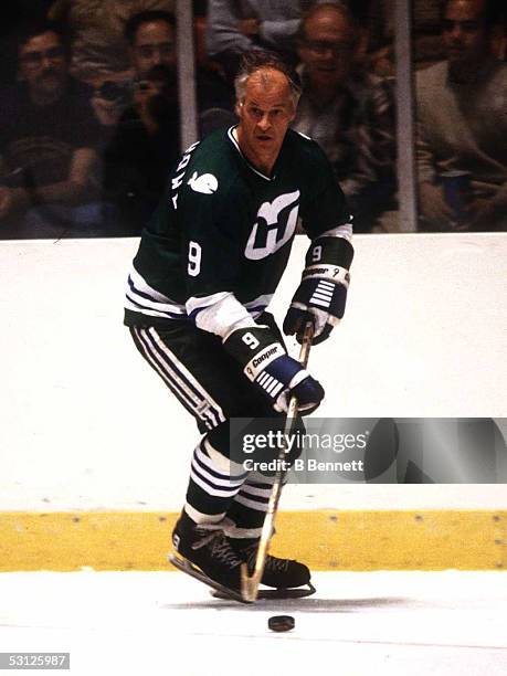 Gordie Howe of the Hartford Whalers skates with the puck during an NHL game circa 1980.