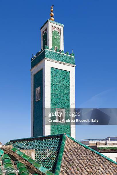bou inania madrasa minaret, meknes, morocco - meknes stock pictures, royalty-free photos & images