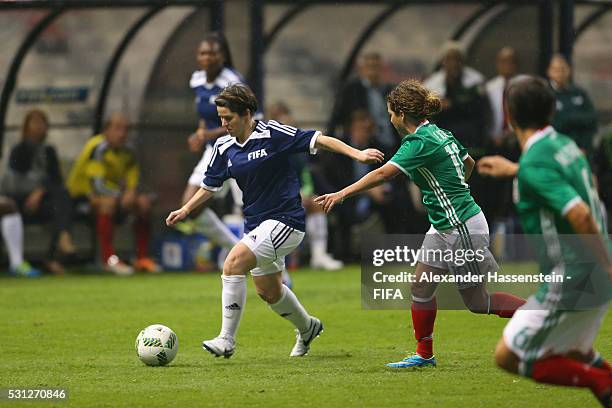 Sarah Ann Walsh of FIFA Legends battles for the ball with Iris Mora of MexicanAllstars during an exhibition match between FIFA Legends and...