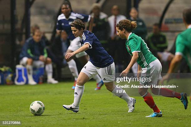 Sarah Ann Walsh of FIFA Legends battles for the ball with Iris Mora of MexicanAllstars during an exhibition match between FIFA Legends and...