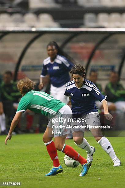 Sarah Ann Walsh of FIFA Legends battles for the ball with Iris Mora of MexicanAllstars during an exhibition match between FIFA Legends and...