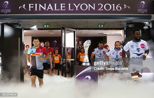 The opposing teams run out onto the pitch prior to kickoff during the European Rugby Challenge Cup Final match between Harlequins and Montpellier at...
