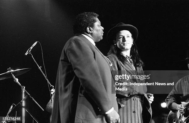 King and Bono on stage at The Point, 26/12/89. During U2's 'Lovetown Tour' of 1989, the legendary blues musician joined them on stage at all but one...