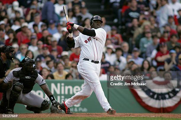 Designated hitter David Ortiz of the Boston Red Sox swings at a Tampa Bay Devil Rays pitch during the game at Fenway Park on April 17, 2005 in...