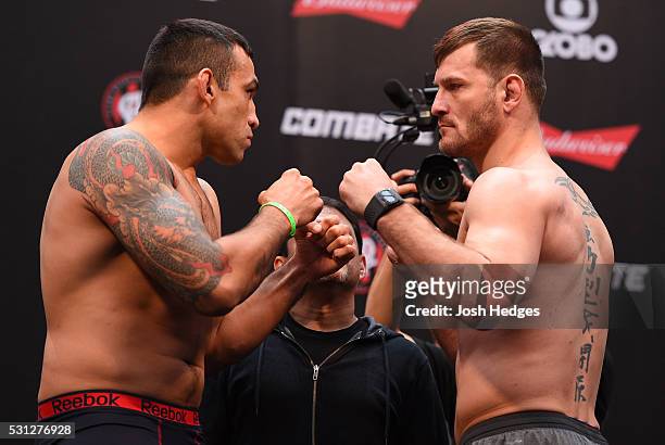 Opponents Fabricio Werdum of Brazil and Stipe Miocic face off during the UFC 198 weigh-in at Arena da Baixada stadium on May 13, 2016 in Curitiba,...