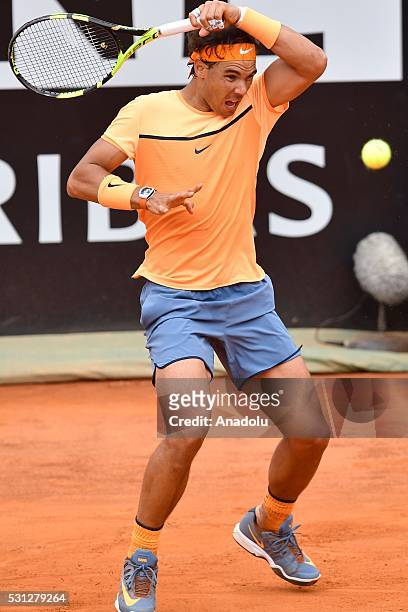 Rafael Nadal of Spain returns a shot against Novak Djokovic of Serbia during the men's single match at The Internazionali BNL d'Italia at the Foro...