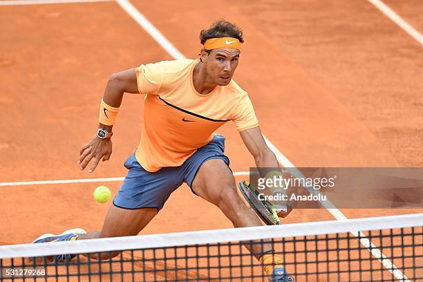 Rafael Nadal of Spain returns a shot against Novak Djokovic of Serbia during the men's single match at The Internazionali BNL d'Italia at the Foro...