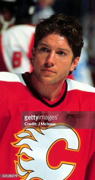 Sheldon Kennedy of the Calgary Flames looks on before an NHL game circa 1996.