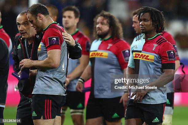 Conor O'Shea the Director of Rugby of Harlequins consoles Jamie Roberts after their 19-26 defeat during the European Rugby Challenge Cup Final match...