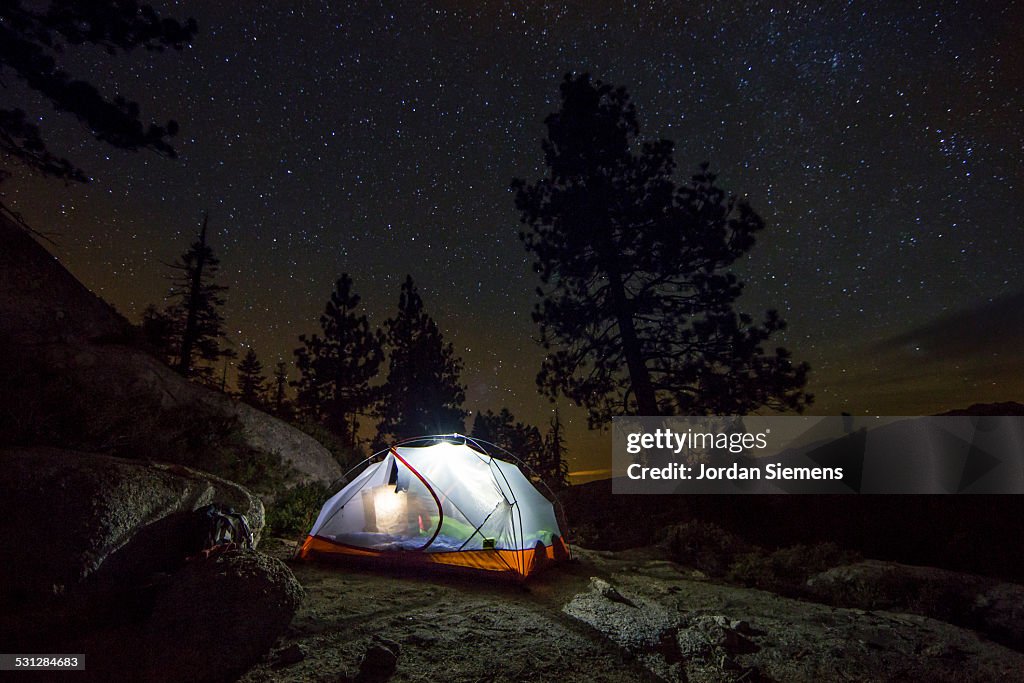 A tent under the night sky.