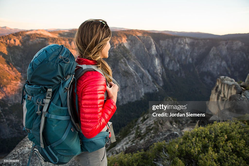 A woman backpacking.
