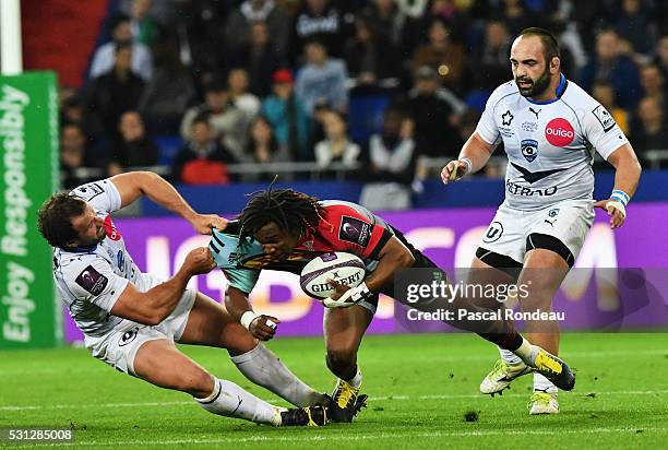 Marland Yarde from Harlequins get caught by Bismarck Du Plessis during the European Rugby Challenge Cup Final match between Harlequins and...