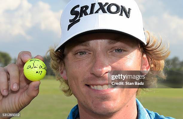 Will Wilcox poses with his golf ball after the second round after making a hole-in-one on the 17th hole at THE PLAYERS Championship on THE PLAYERS...