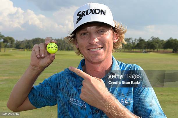 Will Wilcox poses with his golf ball after the second round after making a hole-in-one on the 17th hole at THE PLAYERS Championship on THE PLAYERS...