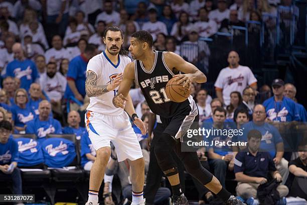 Tim Duncan of the San Antonio Spurs drives around Steven Adams of the Oklahoma City Thunder during Game Three of the Western Conference Semifinals...