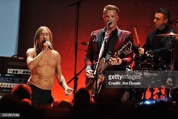 Iggy Pop, Josh Homme and Matt Helders perform live on stage during the Post Pop Depression tour at the Royal Albert Hall on May 13, 2016 in London,...