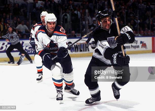 New York's Scott Lachance catches Neal Broten on the forehead with his stick during action between the Islanders and Kings.