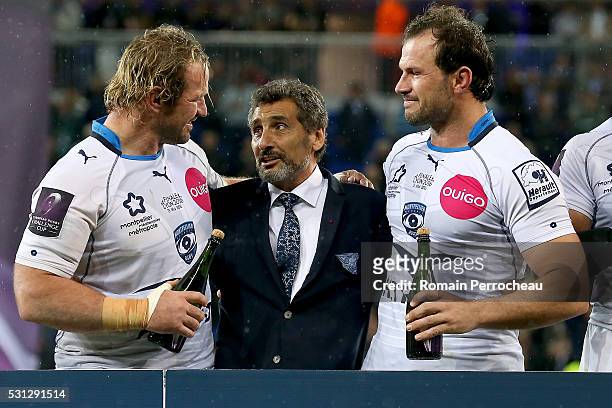 Montpellier's president Mohed Altrad talks with Jannie Du Plessis and Pierre Spies after the European Rugby Challenge Cup Final match between...