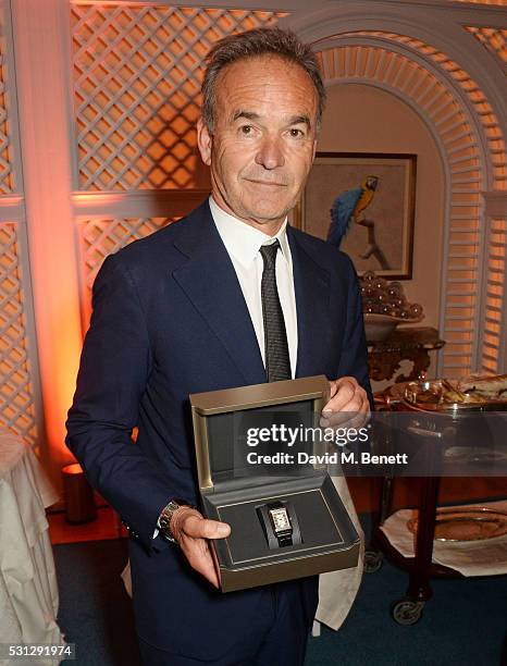 Nick Broomfield accepts his watch at The 8th Annual Filmmakers Dinner hosted by Charles Finch and Jaeger-LeCoultre at Hotel du Cap-Eden Roc on May...