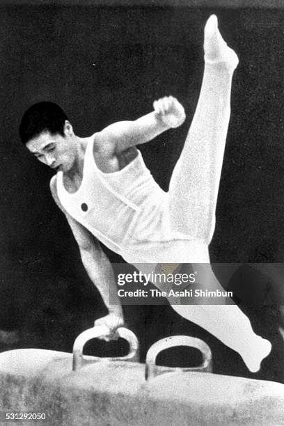 Sawao Kato of Japan competes in the Pommel Horse of the Artistic Gymnastics Men's Team during the Mexico City Summer Olympic Games at the National...