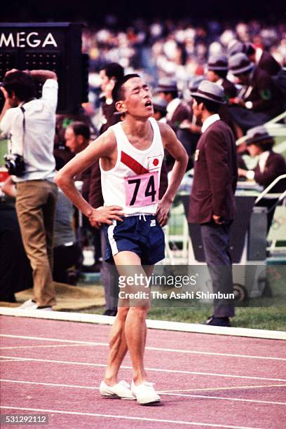 Kenji Kimihara of Japan reacts after winning the silver medal in the Men's Marathon during the Mexico City Summer Olympic Games at Estadio Olimpico...