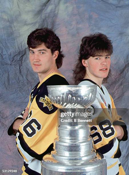 Canadian professional hockey player Mario Lemieux and Czech colleague Jaromir Jagr of the Pittsburgh Penguins stand with the Stanley Cup, early...