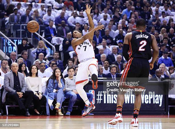 Kyle Lowry of the Toronto Raptors is fouled by Joe Johnson of the Miami Heat in the first half of Game Five of the Eastern Conference Semifinals...